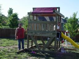 Dan helping out building fort playset.JPG